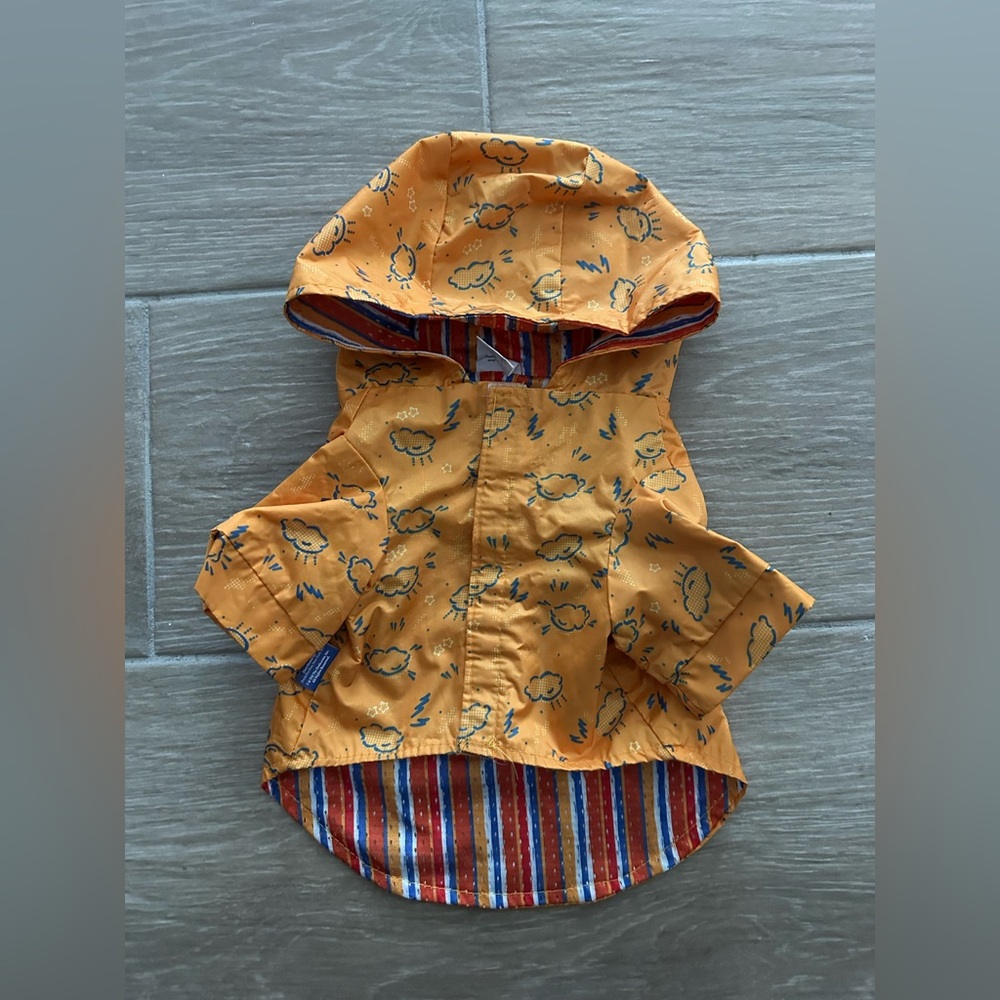 The Dodo orange raincoat, size medium, less then 25 lbs dog